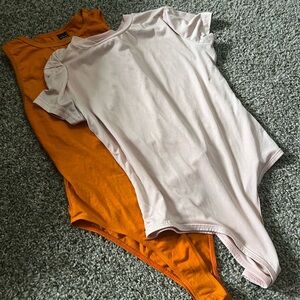 Source Unknown Pink and Orange Bodysuits